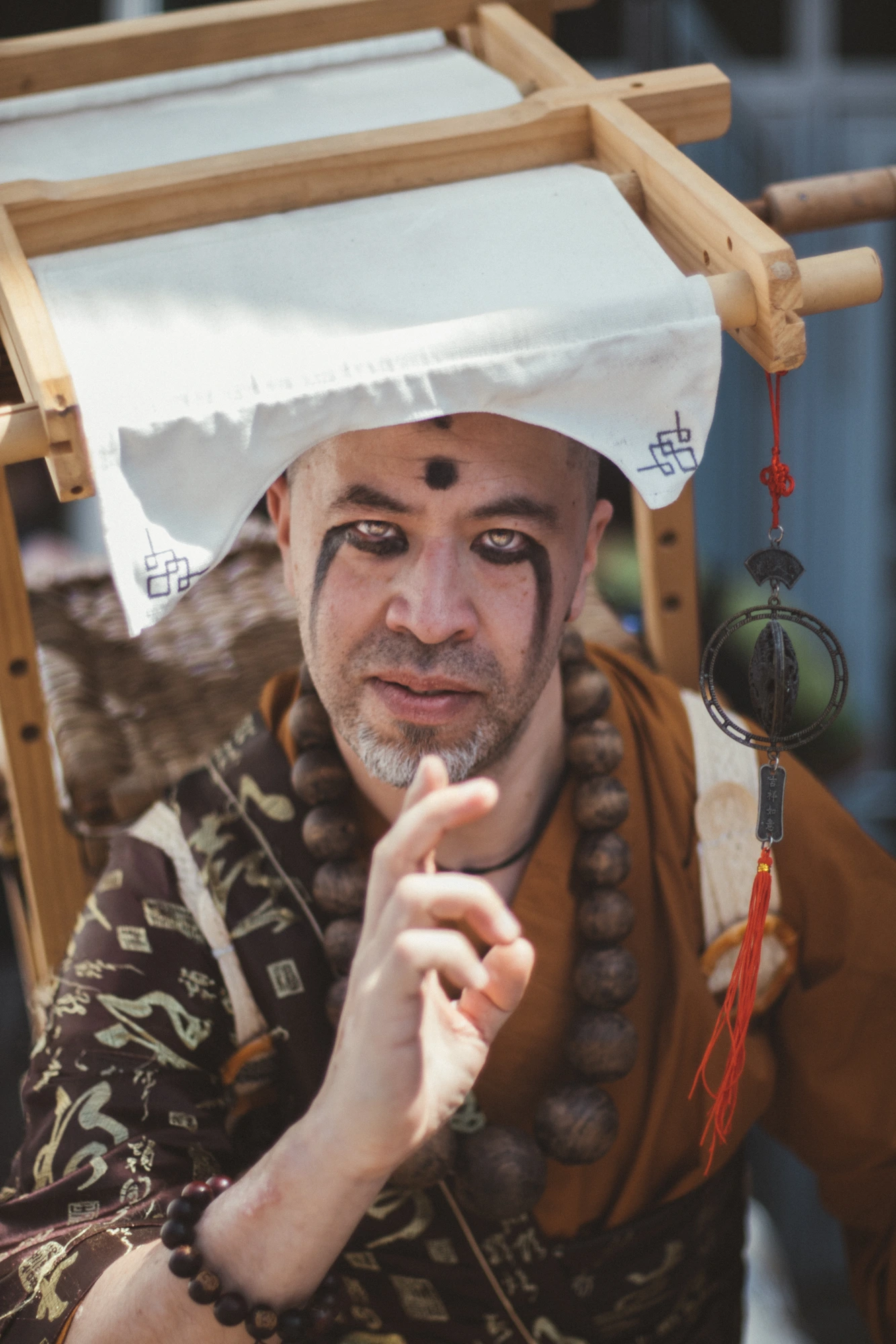 Asian monk inspired cosplay at Dokomi 2026, Messe Dusseldorf — convention photography by KAGEFILM