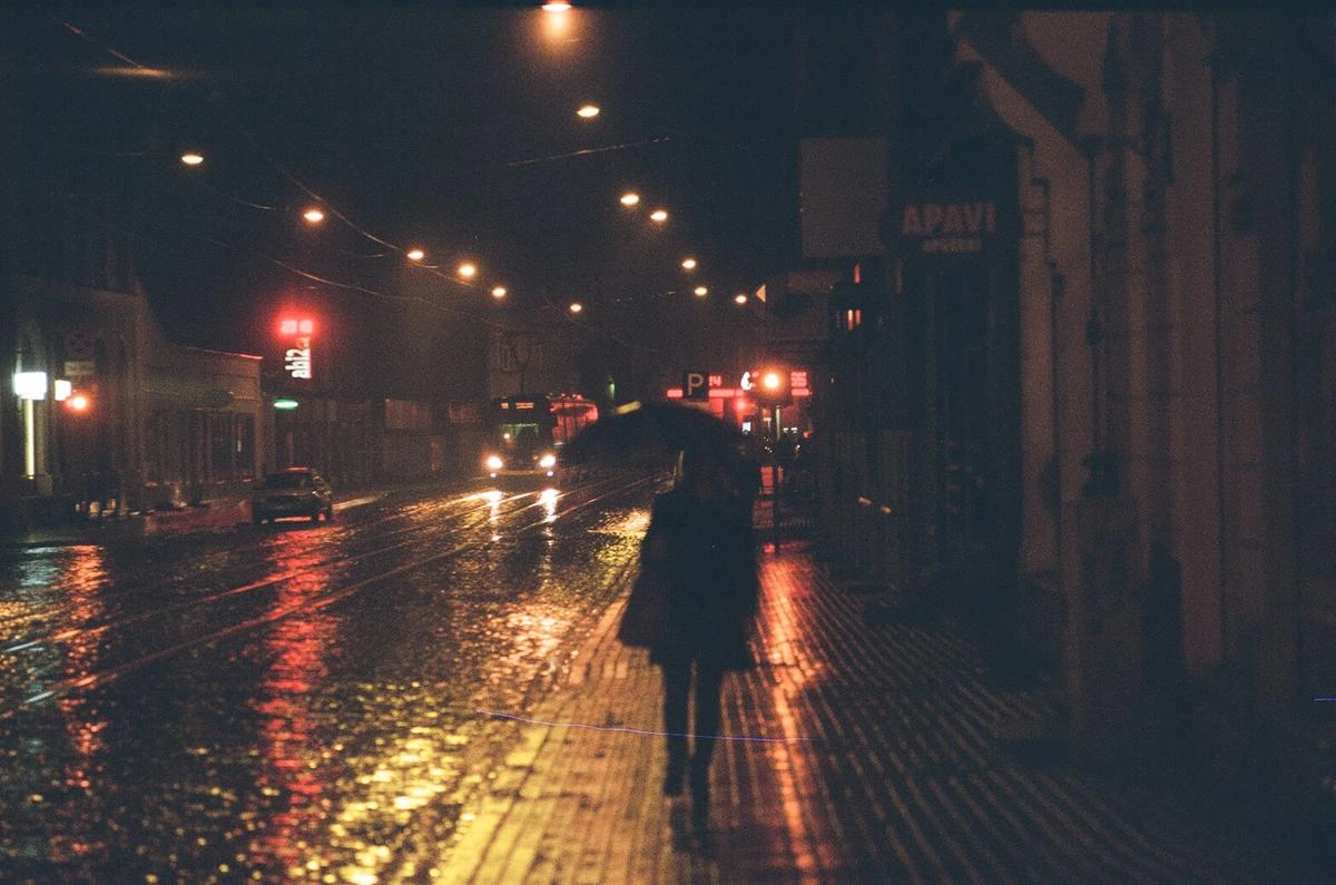Rainy night with umbrella silhouette on Kodak Portra 800 — analog film photography by KAGEFILM